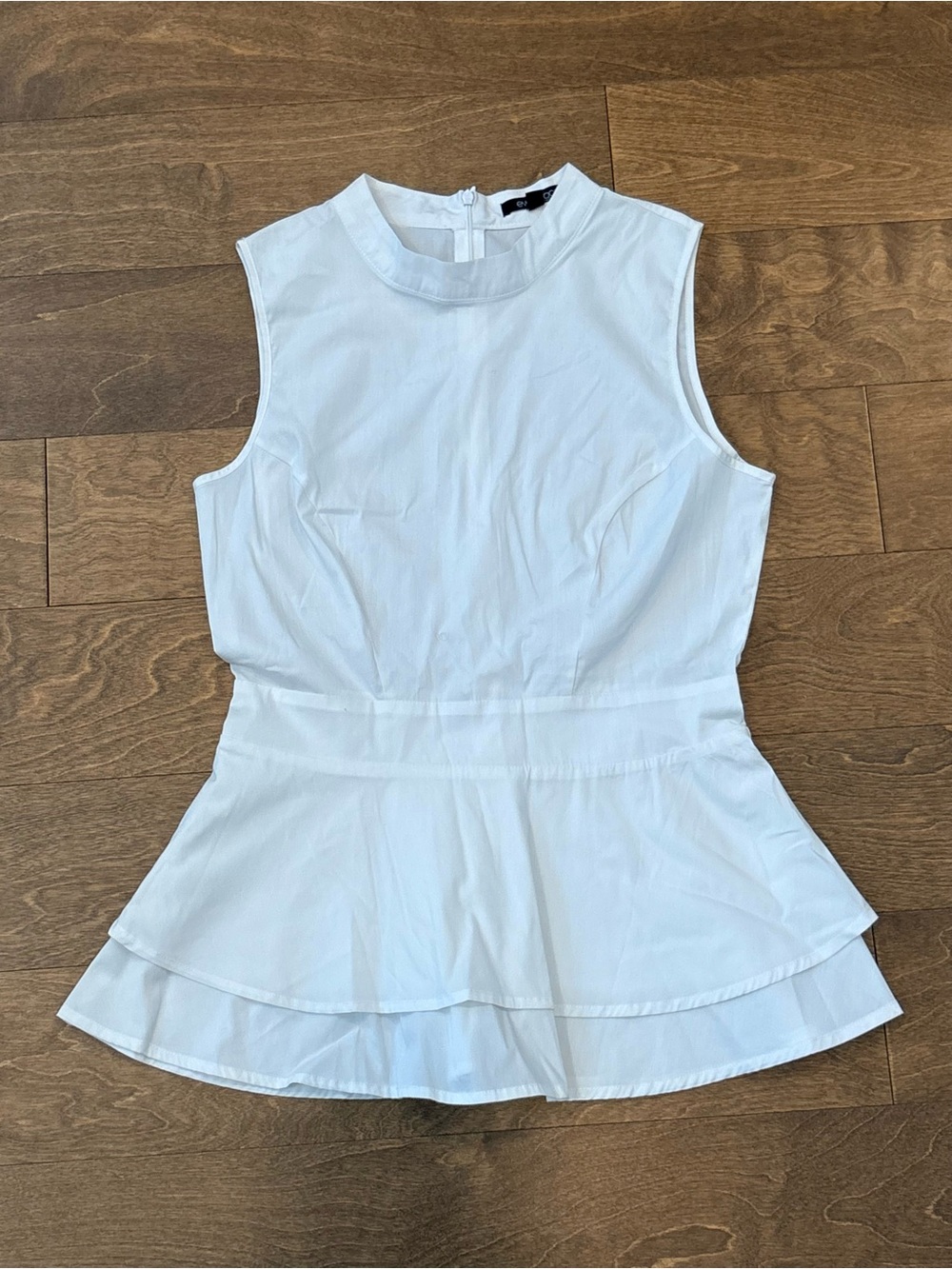 Eva Longoria Sleeveless White Peplum Top, M